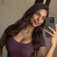 Priya Kapoor in her approved purple-top mirror selfie